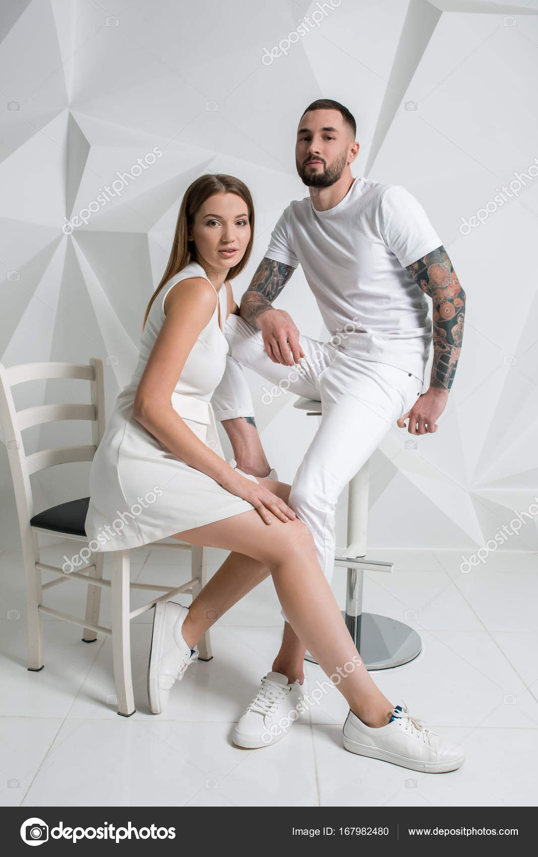 Casual couple near a white wall, man and woman in white clothing. Stock  Photo by ©nazarov.dnepr@gmail.com 167982480