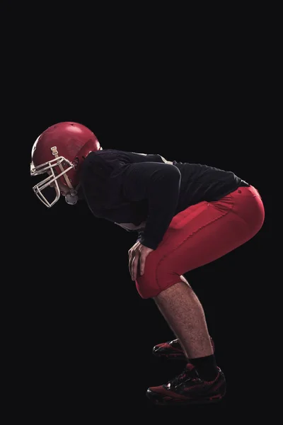 Football player on dark background — Stock Photo, Image