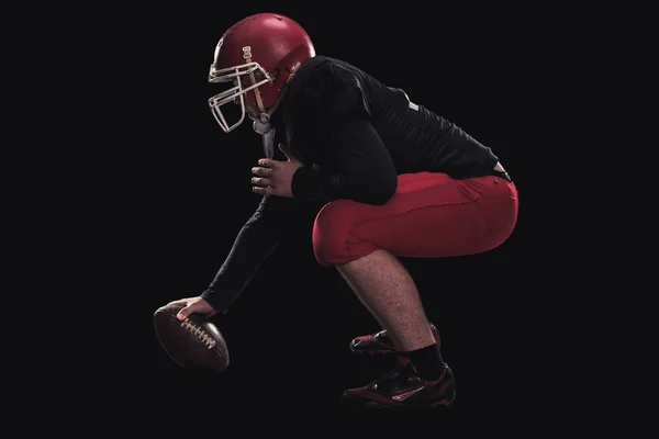 Football player on dark background — Stock Photo, Image