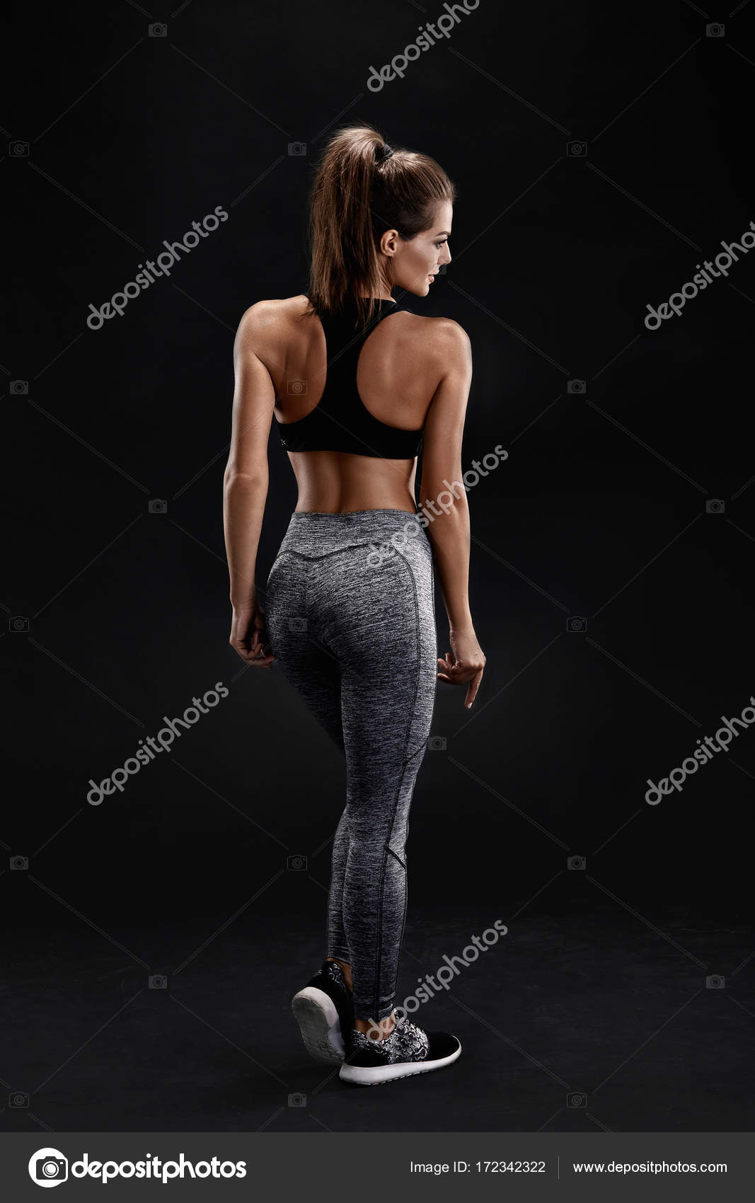 Pretty woman poses in her athletic shorts and top – Jacob Lund Photography  Store- premium stock photo