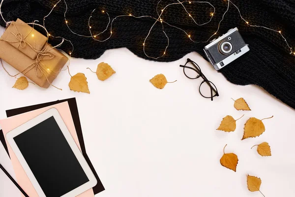 Autumn concept, dried fall leaves, mug of cocoa, old camera, scarf and tablet with blank screen. Mock up — Stock Photo, Image