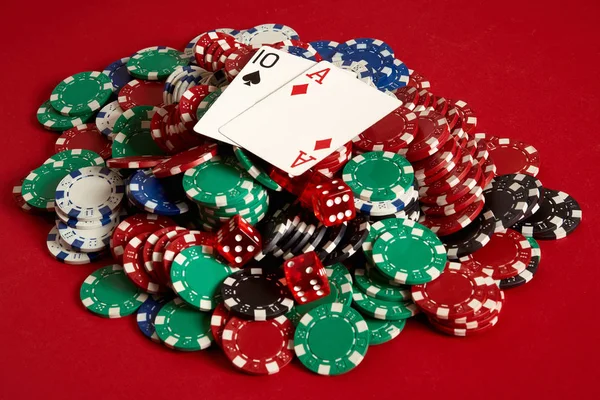 Poker cards and gambling chips on red background — Stock Photo, Image