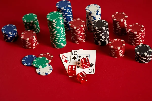 Poker cards and gambling chips on red background — Stock Photo, Image