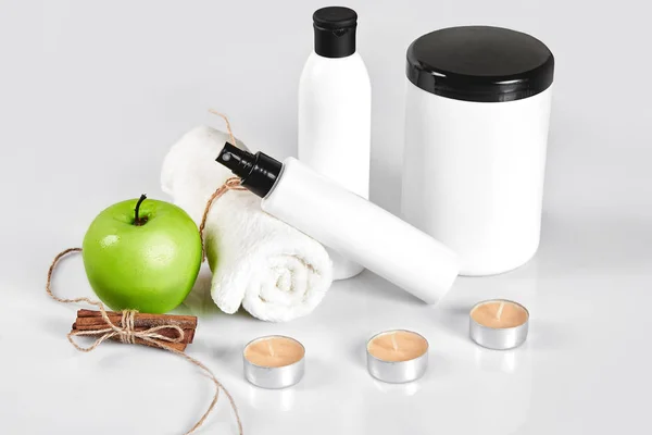 Natural spa beauty treatment cleansing products with apple on white background. — Stock Photo, Image