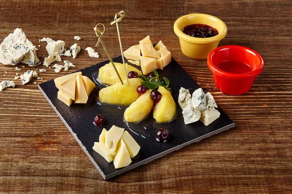 Wine and cheese plate - four kinds of cheese, pear, honey. Excellent appetizer wine.