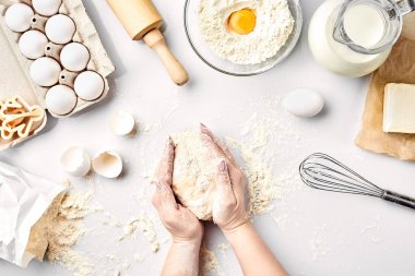 Baker preparing to knead the dough, top view. Cooking, bakery concept clipart