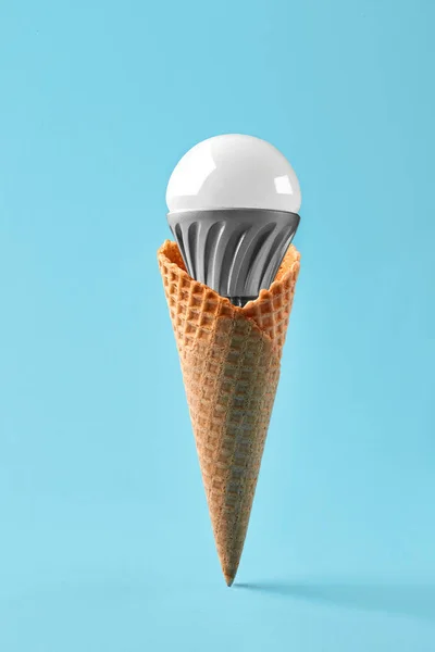 Led lamp in ice cream cone, innovation concept — Stock Photo, Image