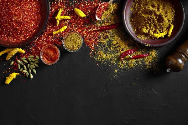 Exotically Spice Mix - spice, herbs, powder top view over dark background. Cooking and spicy food concept. Copy space