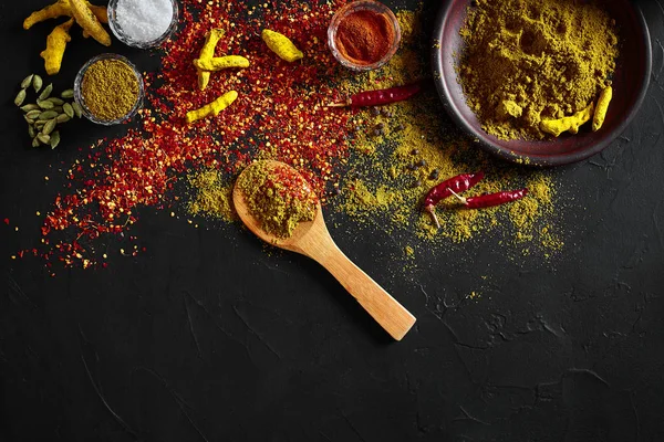 Exotically Spice Mix - spice, herbs, powder top view over dark background. Cooking and spicy food concept. Copy space