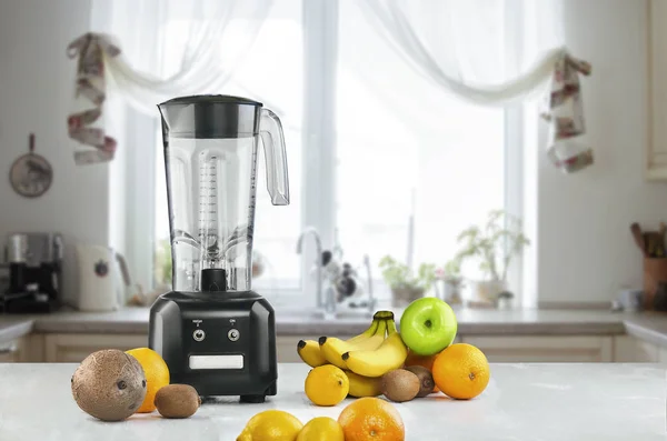 Blender and fruits on kitchen space — Stock Photo, Image