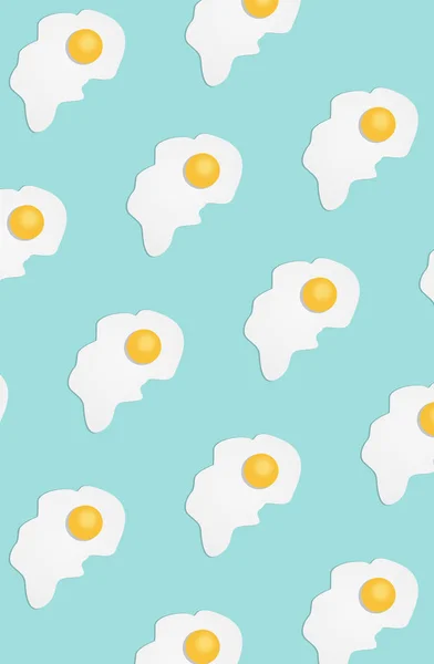 Broken egg on a light blue background — Stock Photo, Image