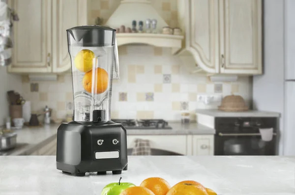 Orange juice blender machine in the kitchen interior