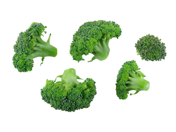 Öt friss brokkoli, fehér alapon elkülönítve, szöveges vagy képmásolási hellyel. Ehető zöldség nagy virágos fejjel. Oldalnézetből. Közelkép. — Stock Fotó