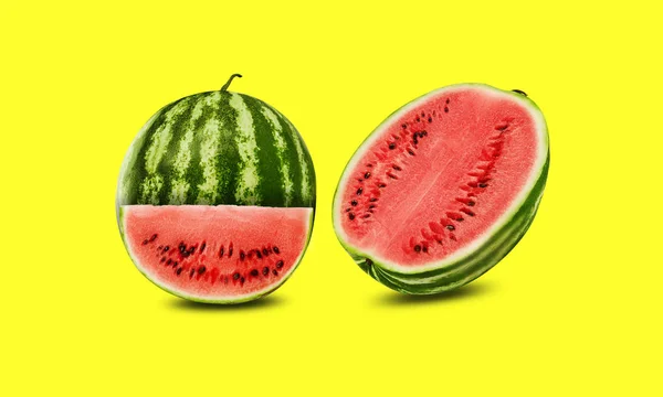 Green, striped watermelon, yellow background with copy space for text, image. Cross-section. Berry with pink flesh, black seeds. Side view. Close-up. — Stock Photo, Image