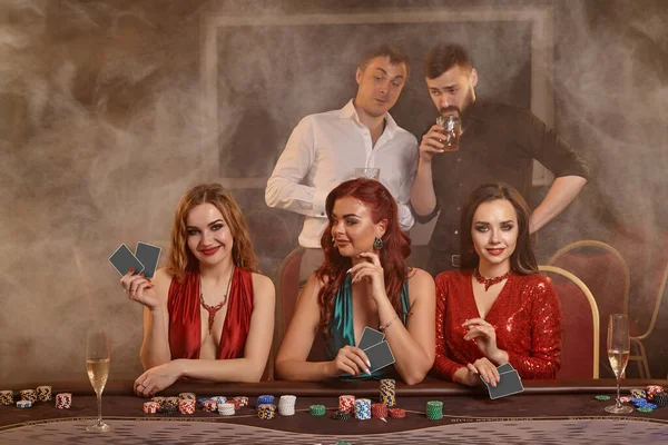 Concentrated Companions Playing Poker Casino Golden Youth Making Bets Waiting — Stock Photo, Image