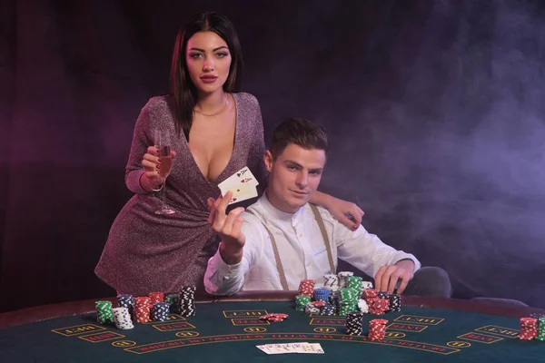 Guy Holding Two Cards Playing Poker Casino Sitting Table Stacks — Stock Photo, Image