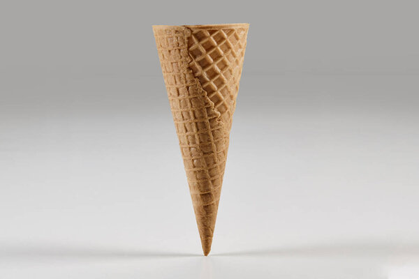 Empty, delicious, big wafer cone for ice cream isolated on white background. Concept of food and treats. Mockup, template for your advertising and design. Close up, copy space