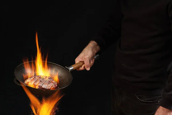 Young Fellow Dressed Jumper Jeans Holding Burning Wok Pan Fire — Stock Photo, Image