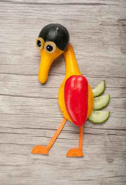 Sad bird made of vegetables
