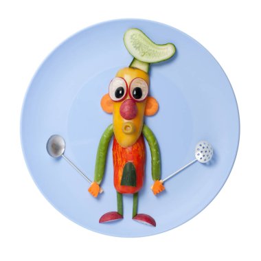 Mavi plaka üzerinde sebze ile yapılan Şef