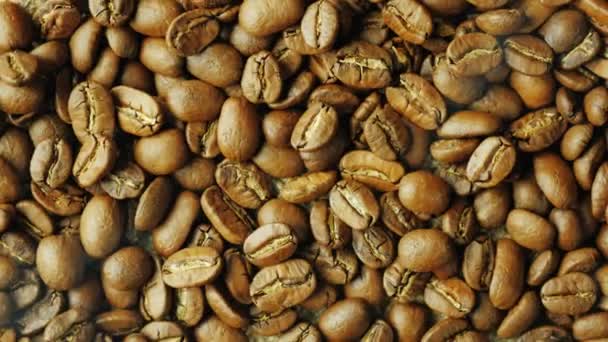 Hot choicest Arabica beans, rotate. Above them, a wisp of smoke — Stock Video