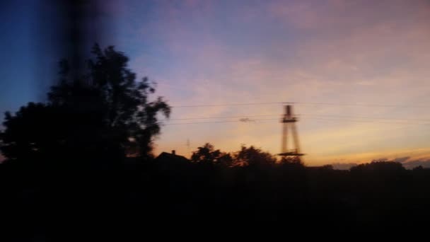 View from the train window. Early morning, trees are running fast, poles. 4K video — Stock Video