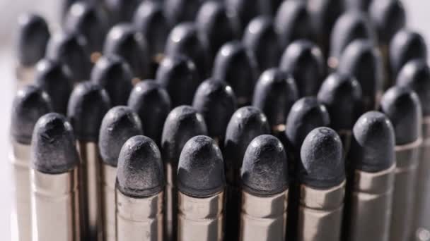 Pistol Cartridges 38 caliber. Stand in rows, slowly rotate. — Stock Video