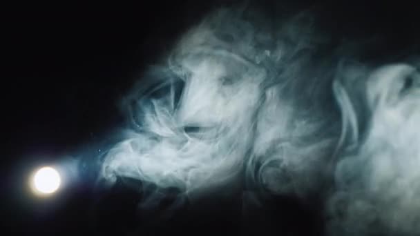 Lantern illuminates smoke on a black background — Stock Video