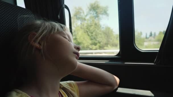 Little girl sleeps on car window, tedious ride — 비디오