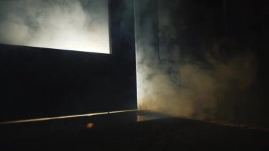 Smoke of fire coming from the cracks under the door in the room