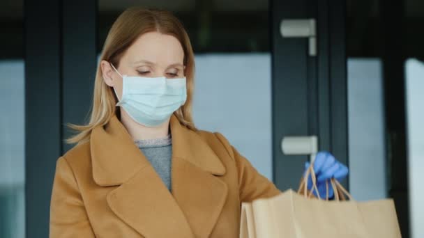 Portrait of a volunteer with bags of food from the grocery store — Stock Video