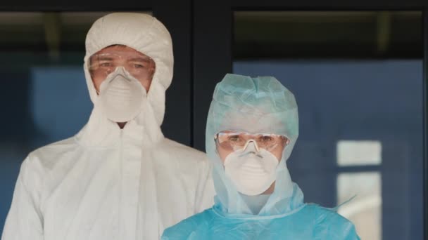 Tired hospital staff in protective suits — Stock Video