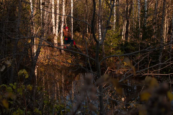 Blonde girl in the wild autumn forest — Stock Photo, Image