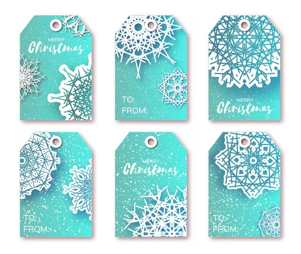 Blue Christmas labels with origami white snowflake.