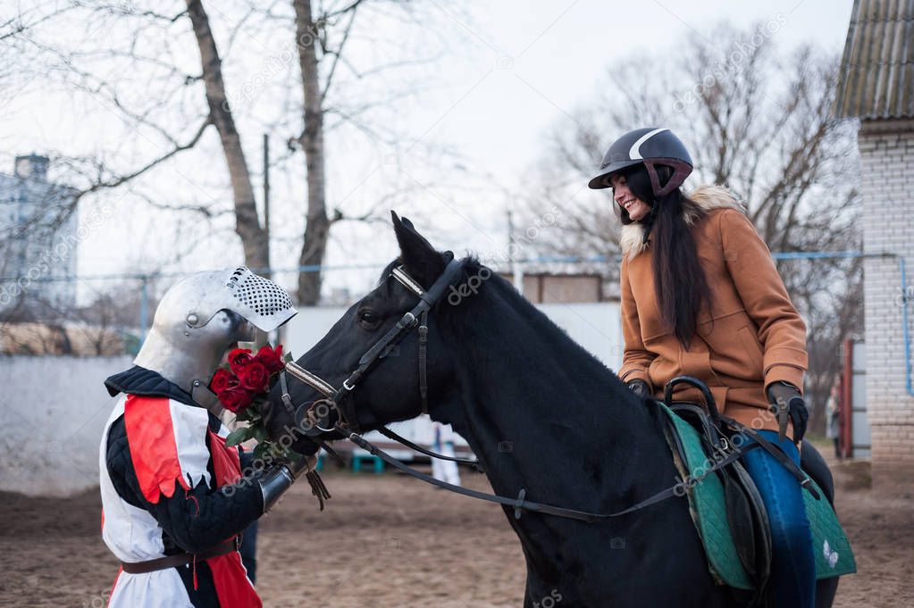 Medieval knight makes the offer of a lady on horsebac
