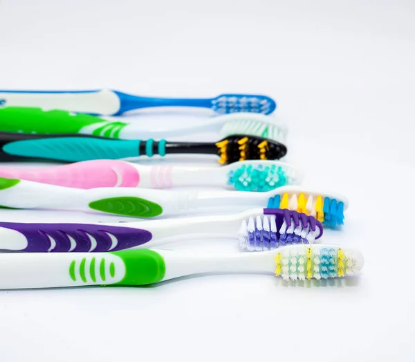 Various toothbrushes on a white backgroun — Stock Photo, Image