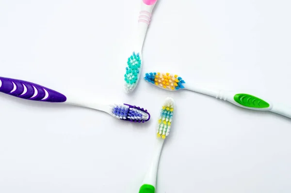 Various toothbrushes on a white backgroun — Stock Photo, Image