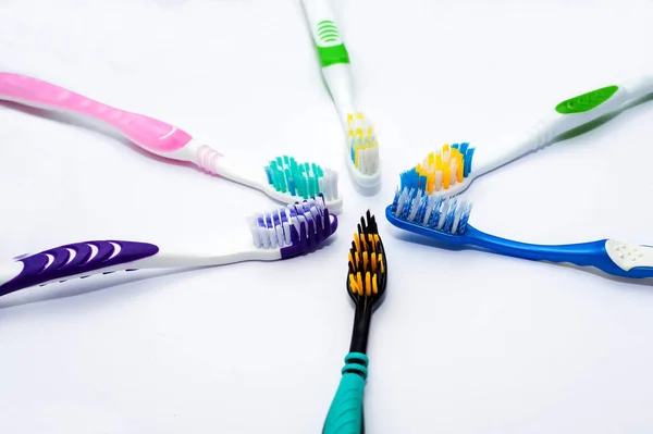 Various toothbrushes on a white backgroun — Stock Photo, Image