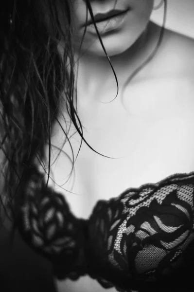 portrait of a naked woman on a black background