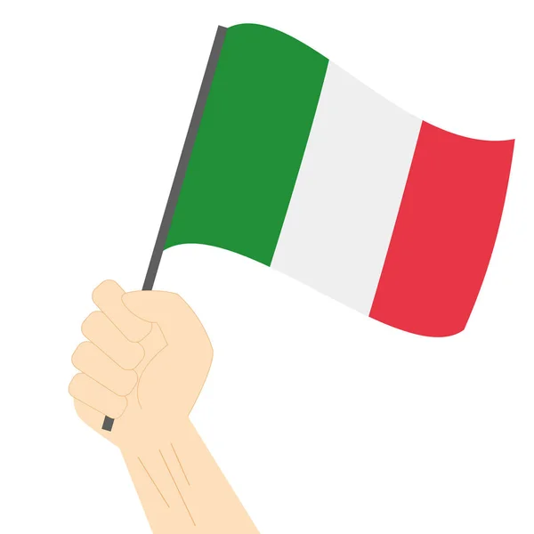 Mão segurando e levantando a bandeira nacional da Itália — Vetor de Stock