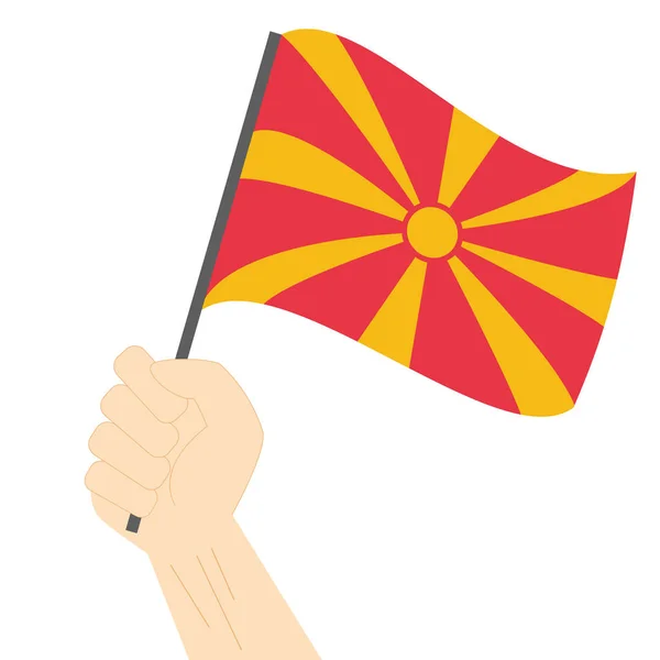 Sostener y izar la bandera nacional de Macedonia — Vector de stock