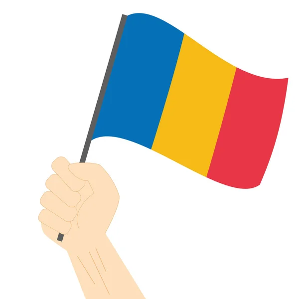 Hand holding en verhoging van de nationale vlag van Roemenië — Stockvector