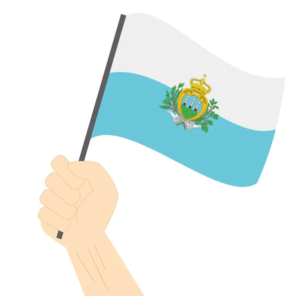 Mão segurando e levantando a bandeira nacional de San Marino — Vetor de Stock