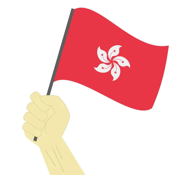 Mão segurando e levantando a bandeira nacional de Hong Kong — Vetor de Stock