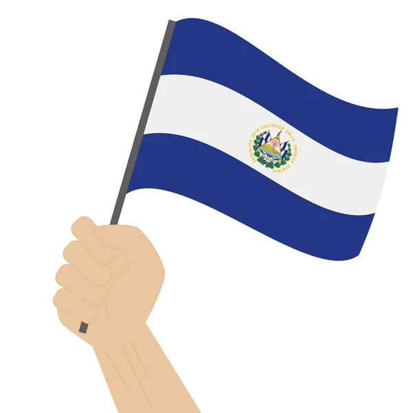 Mão segurando e levantando a bandeira nacional de El Salvador —  Vetores de Stock