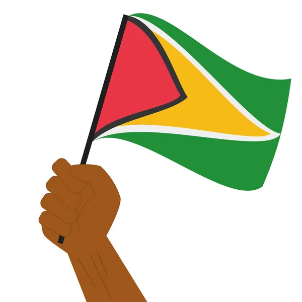 Hand holding en verhoging van de nationale vlag van Guyana — Stockvector