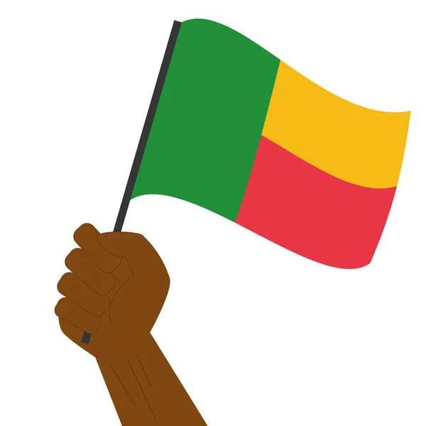 Hand halten und die Nationalflagge von Benin hissen — Stockvektor