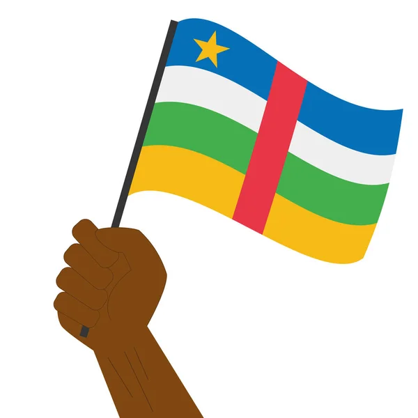 Hand holding en verhoging van de nationale vlag van de Centraal-Afrikaanse Republiek — Stockvector