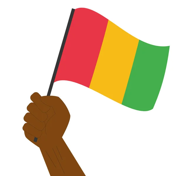 手持ちとギニアの国旗掲揚 — ストックベクタ