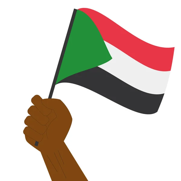 Hand holding en verhoging van de nationale vlag van Soedan — Stockvector